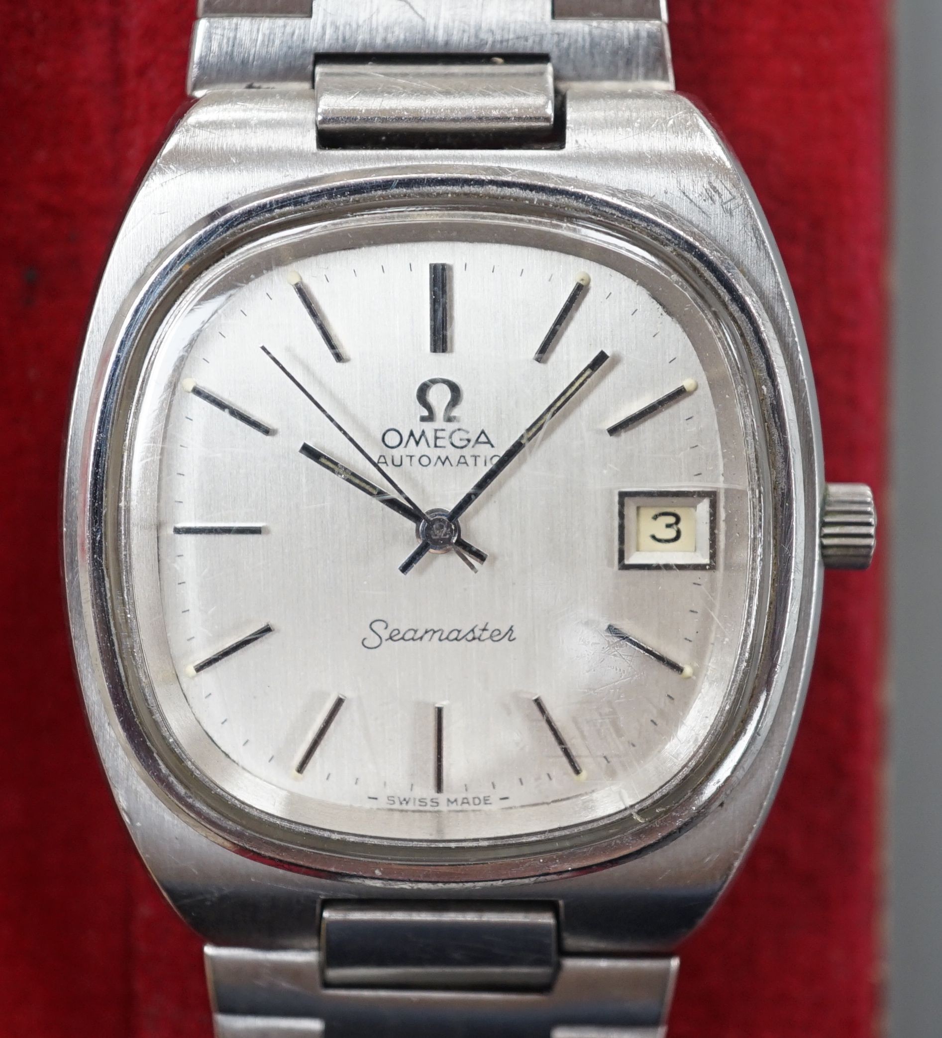 A gentleman's 1970's stainless steel Omega Seamaster automatic wrist watch, on a stainless steel Omega bracelet, with box, spare link, spare glass and original guarantee, case diameter 36mm.